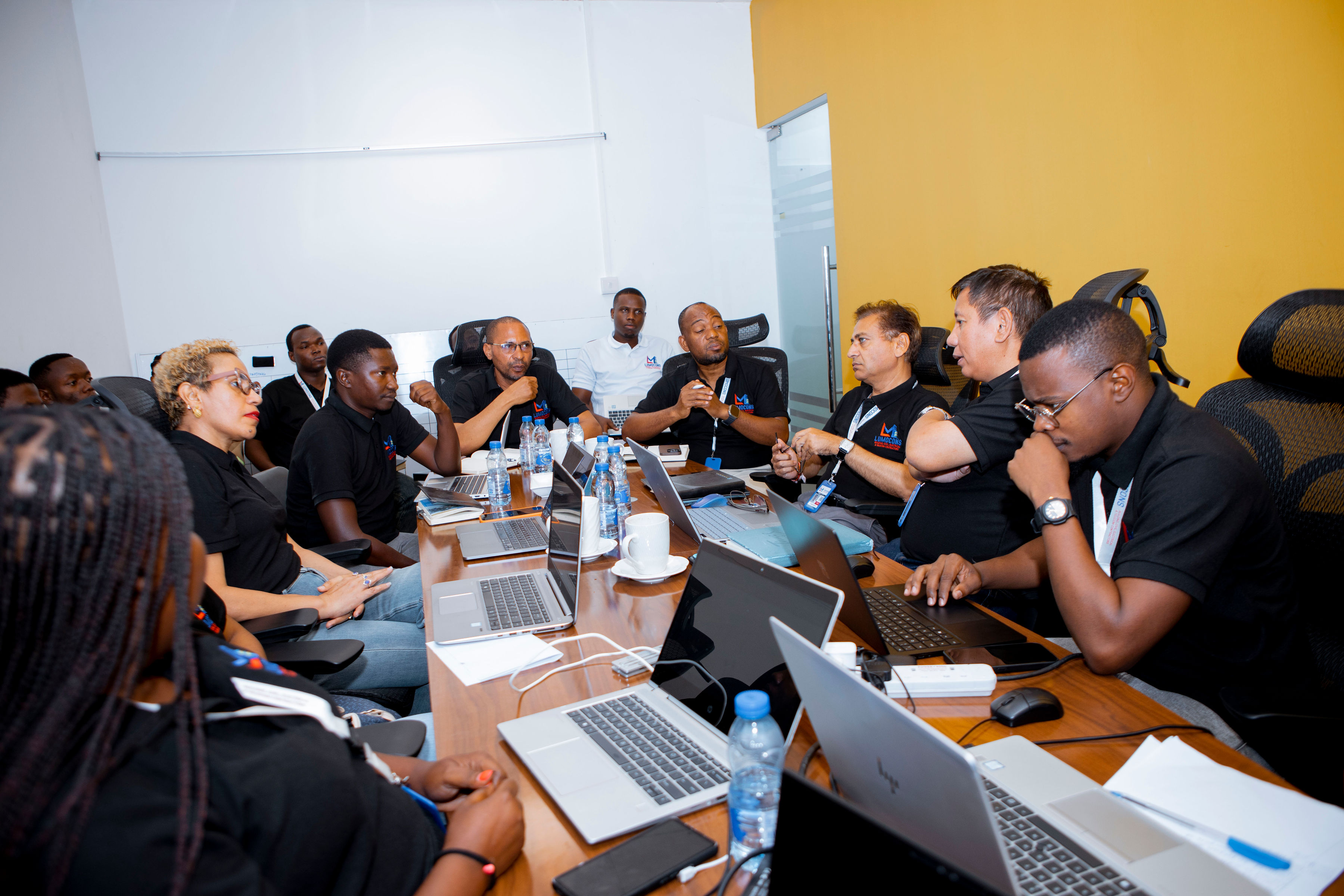 LUMOCONS team collaboration in boardroom meeting